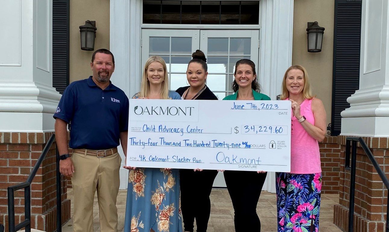 Oakmont Slacker Run Raises $34,229.60 for Child Advocacy Center in Gainesville - SR Check Photo 6 2023 e1686332148273